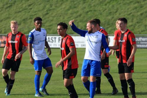 Enfields Billy Bricknell (White, R) suggests that someone should be in front of Leon Redwood