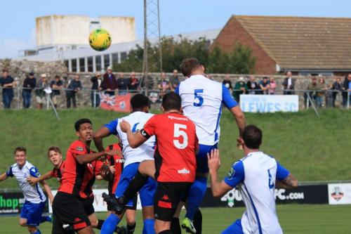 Enfields Dan Rumens (white no 5) sends a header on goal