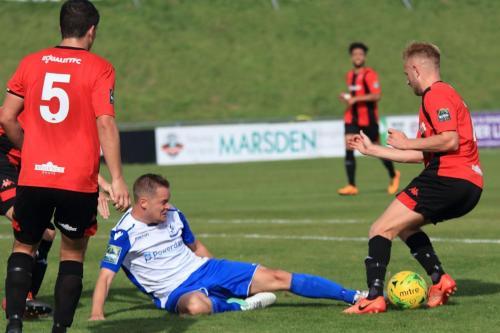 Enfields Liam hope (white) challenges James Hammond