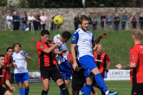 Enfields Remis Sutton (white,R) and Liam Hope challenge at a set piece