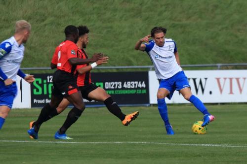 Enfields Sam Youngs tries to turn past Michael Dome-Bemwin (2) and Nico Cotton