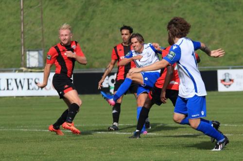 Enfields Sam youngs shoots from the edge of the penalty area