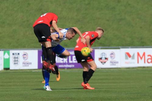 Lewes Frankie Chappell (L) is penalised for a foul on Liam Hope