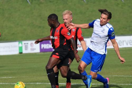 Lewes Michael Dome-Bemwin (L) robs Sam Youngs on the edge of the penalty area