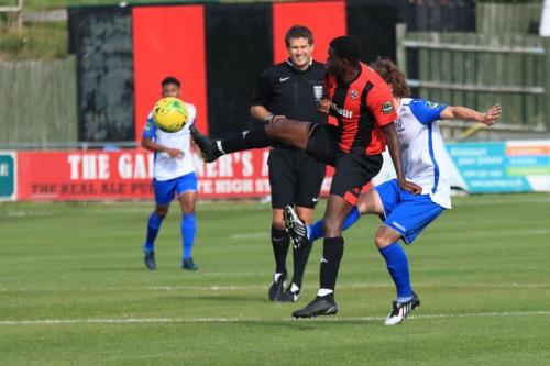 Lewes Omarr Lawson (L) clears from Sam Chaney