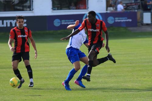 Lewes Omarr Lawson (R) clears from Sam Youngs
