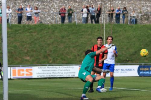 Lewes keeper Lewis Carey saves from Sam Chaney