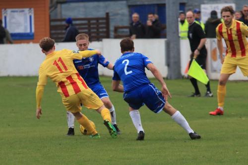 Enfields Aaron Greene and Lowestofts Conor McKendry and Adam Tann (R)