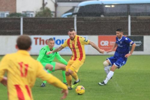 Enfields Billy Bricknell is forced wide by keeper Elvijs Putnins