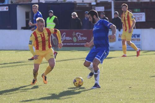 Enfields Ryan Blackman (L) and Lowestofts Connor Deeks