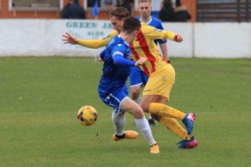 Enfields Sam Youngs (R) turns inside Henry Pollock
