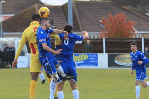 Enfields Taofiq Olomowewe (5) heads on goal