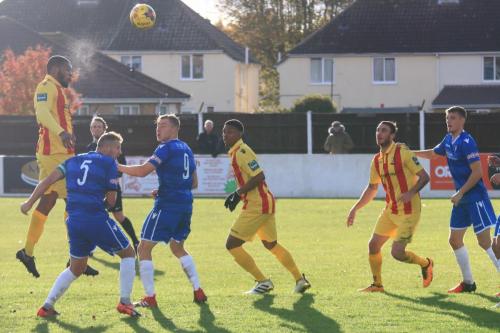 Enfields Taofiq Olomowewe (L) heads on goal
