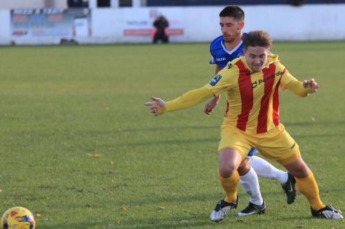 Lowestofts Matt Brown is penalised for pulling Lewis Taaffes shirt