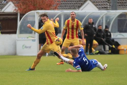 Lowestofts Rossi Jarvis (blue) challenges Sam Youngs