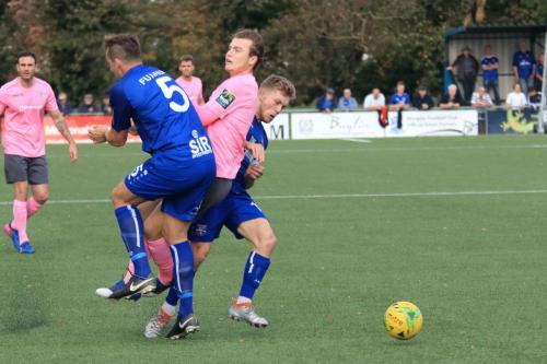 Enfields Mickey Parcell (pink) is blocked by Liam Friend (5) and Chris Barnard