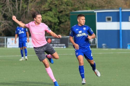 Enfields Sam Youngs (L) and Margates Jordy Robins watch as Youngs shot flies narrowly wide