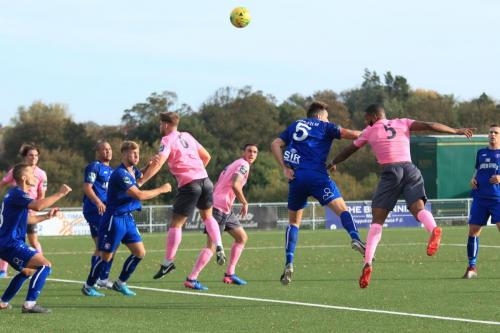 Enfields Taofiq Olomowewe (pink no 5) heads narrowly wide