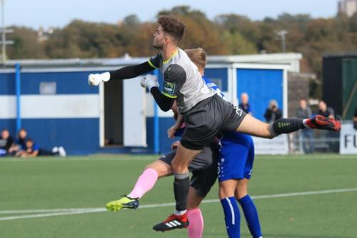Margate keeper Henry Newcombe punches clear
