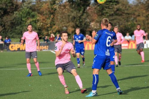 Margates Ben Swift (R) heads clear from Bilal Sayoud