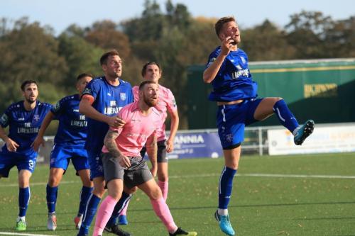 Margates Ben Swift (R) heads clear from Billy Bricknell