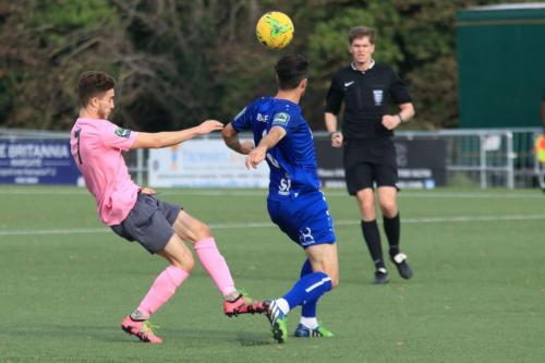 Margates Tom Mills (blue) heads clear from Bilal Sayoud