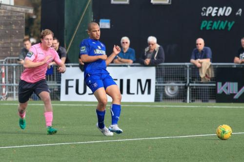 Margates Tom Wynter (R) plays the ball to his keeper as Aaron Greene chases