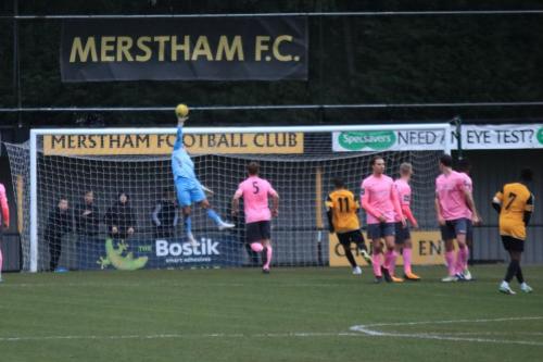 Enfield keeper Joe Wright tips a free kick from Kershaney Samuels (7) over the bar