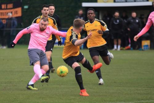 Enfields Billy Bricknell (pink) sees his shot deflected by Tom Bird