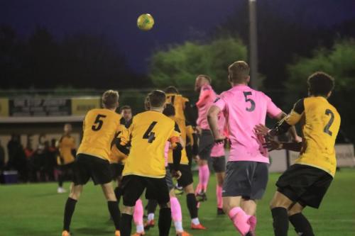 Enfields Billy Bricknell (pink, L) heads the ball forward  Marc Weatherstone (pink 5) put it in the net but was ruled offside