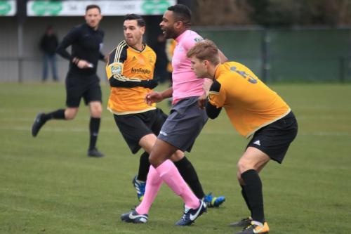 Enfields Kezie Ibe and Mersthams Tom Kavanagh (L) and Oliver Cook