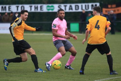 Enfields Kezie Ibe and Mersthams Tom Kavanagh (L) and Simon Cooperx