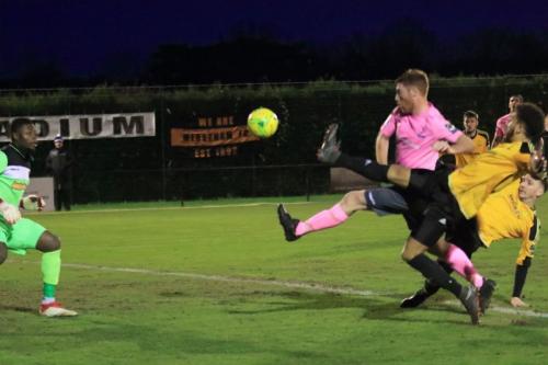 Enfields Marc Weatherstone (pink) beats Amadou Tangara but is given offside