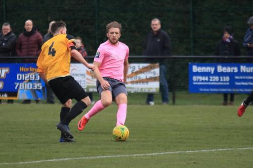 Enfields Remi Sutton (R) and Mersthams Simon Cooper