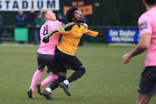 Enfields Ryan Blackman (L) and Mersthams Walter Figueira