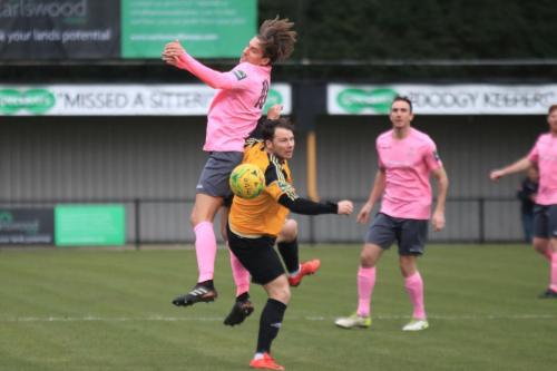 Enfields Sam Youngs (L) challenges Kenny Beaney