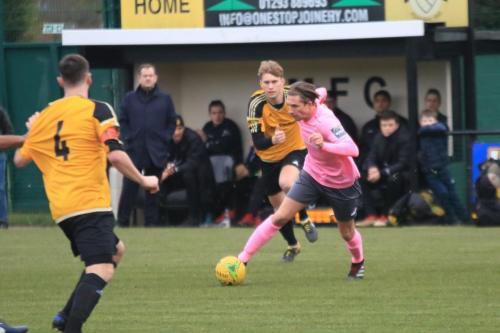 Enfields Sam Youngs and Mersthams Simon Cooper (4) and Oliver Cook