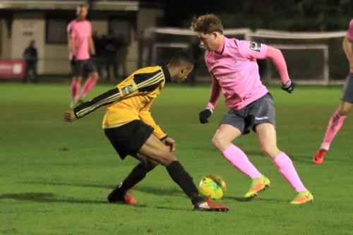 Mersthams Gus Sow (L) and Enfields Aaron Greene