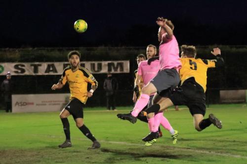 Mersthams Oliver Cook (R) challenges Marc Weatherstone