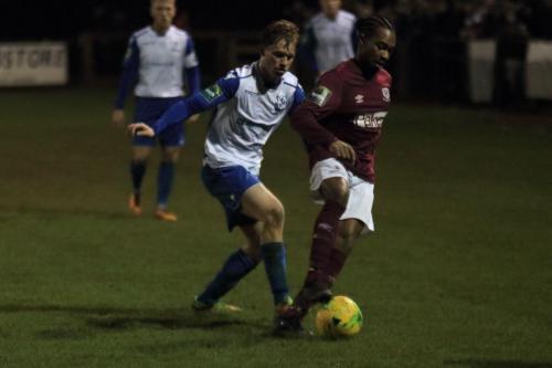 Enfields Aaron Greene (L) challenges Dernell Wynter