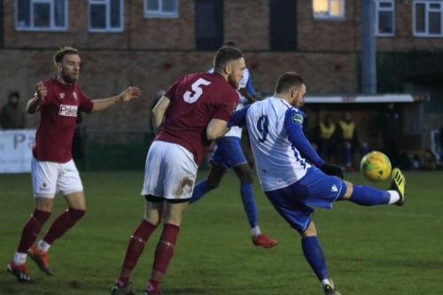 Enfields Billy Bricknell (9) holds off James Budden