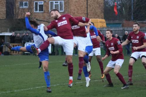 Enfields Sam Youngs (L) challenges Potters Bars Lee OLeary