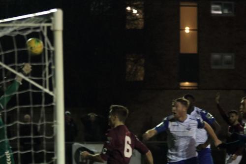 Potters Bar keeper Berkley Laurencin tips Marc Weatherstones header onto the bar but Weatherstone scores from the rebound