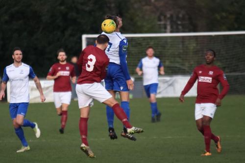 Potters Bars Andrew Lomas (3) challenges Sam Youngs