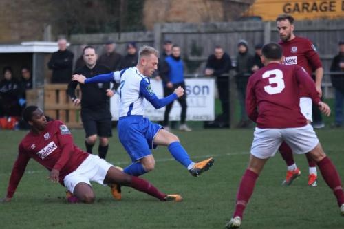 Potters Bars Stefan Powell (L) challenges Ryan Blackman