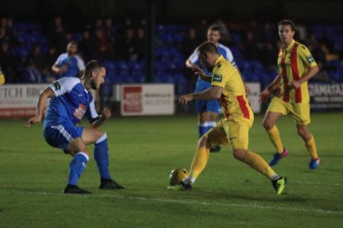 Enfields Billy Bricknell (L) runs at Arthur Lee