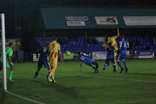 Enfields Matt Johnson (yellow red R) heads on goal