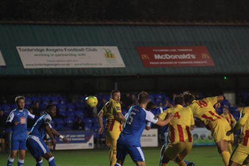 Enfields Sam Youngs (10) sends a header wide of the goal
