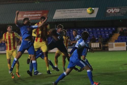 Taofiq Olomowewe (yellow red) puts Enfield 2-0 ahead