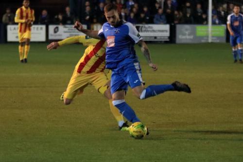 Tonbridges Arthur Lee (blue) clears from Lewis Taaffe
